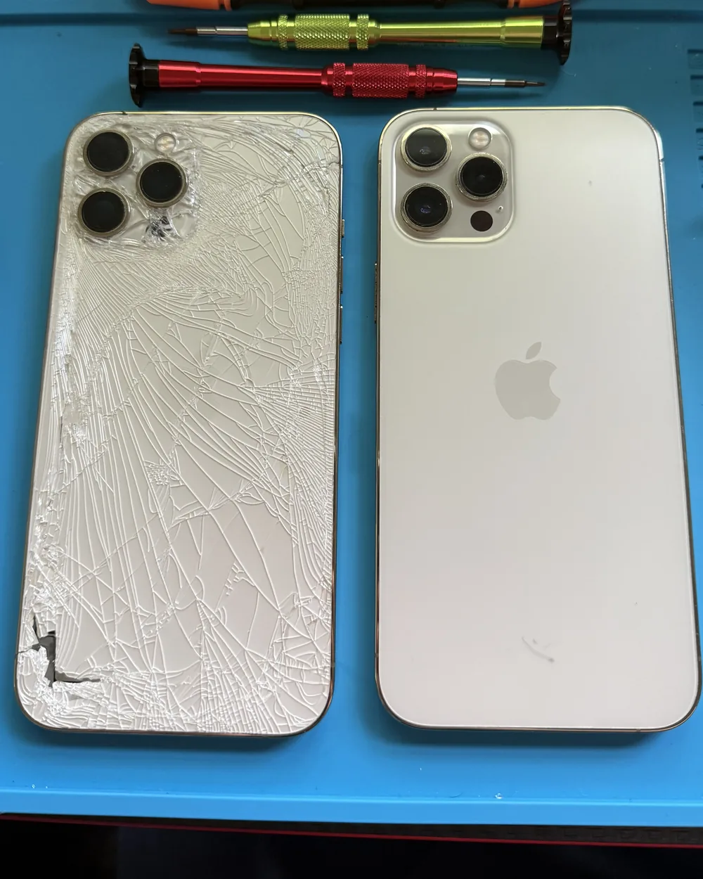 Cracked iPhone back panel next to a new replacement panel after a back-glass repair by Mobile Fix VA
