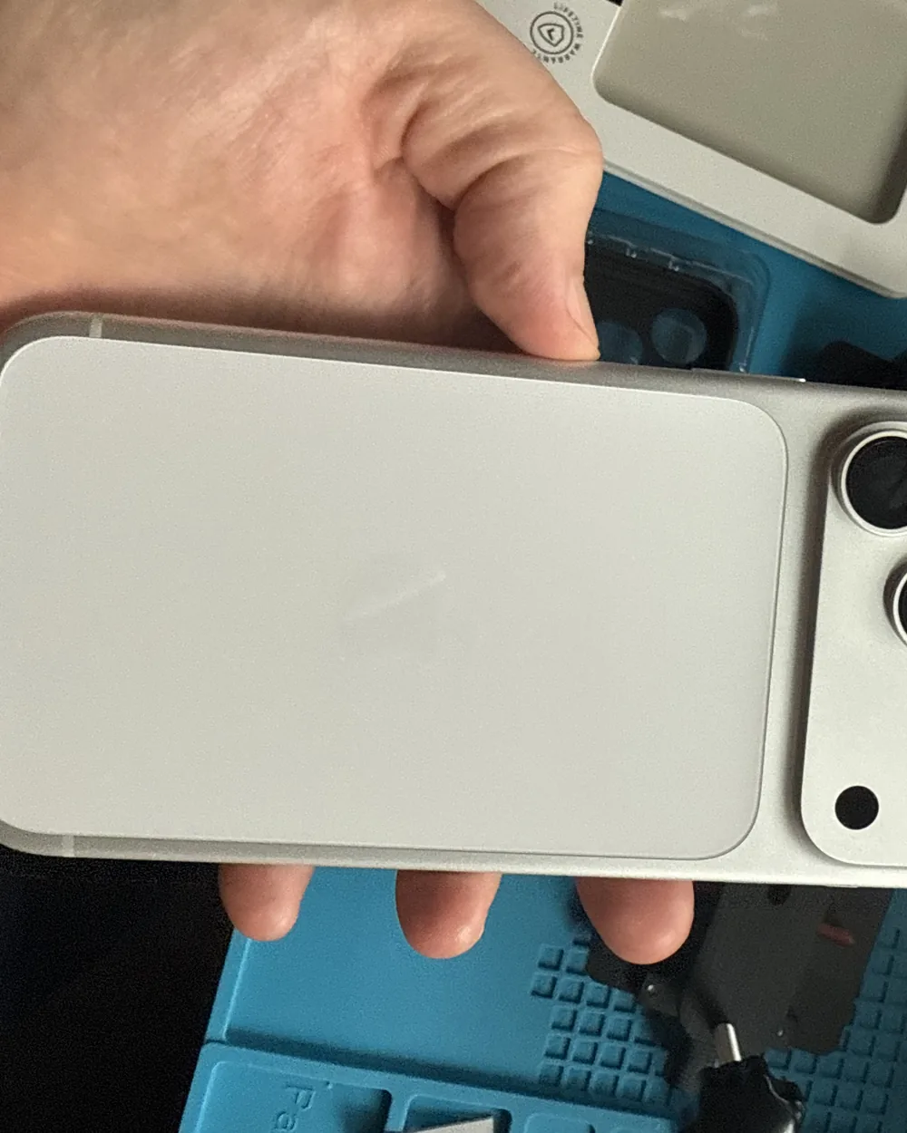 iPhone back housing held up after a back-housing replacement by Mobile Fix VA