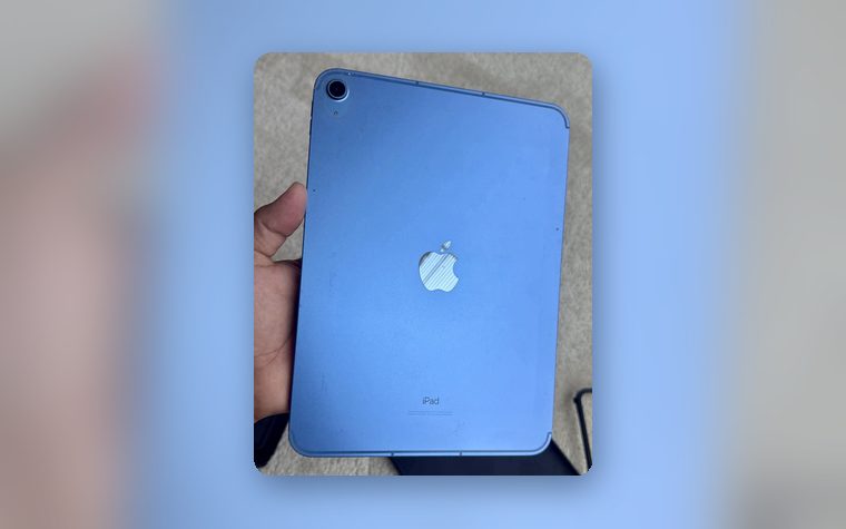 Blue iPad held up after a repair