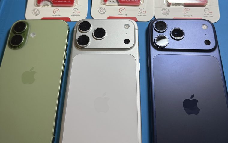 Three iPhones with new camera lens protectors fitted