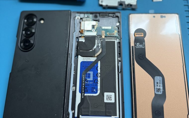 Samsung Galaxy Z Fold opened with its replacement screen beside it